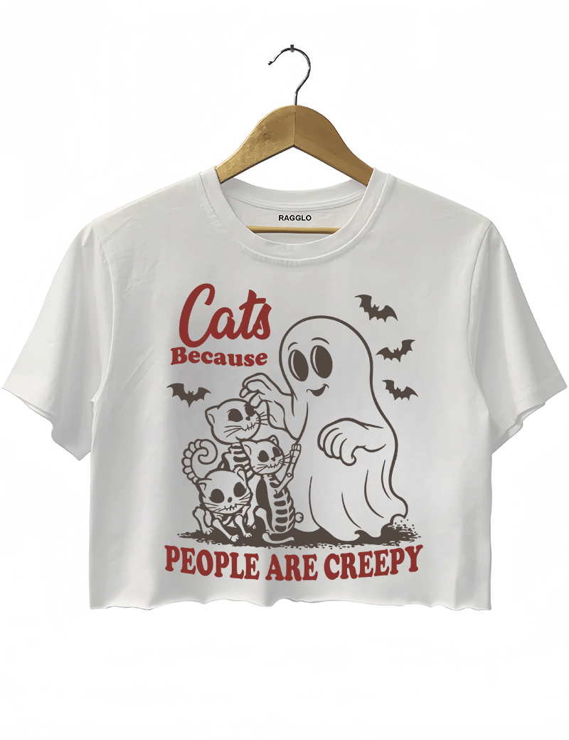 Ragglo white crop top featuring a ghost and three skeleton cats with bats and 'CATS BECAUSE PEOPLE ARE CREEPY' text, perfect for funny Halloween streetwear and cat lovers.