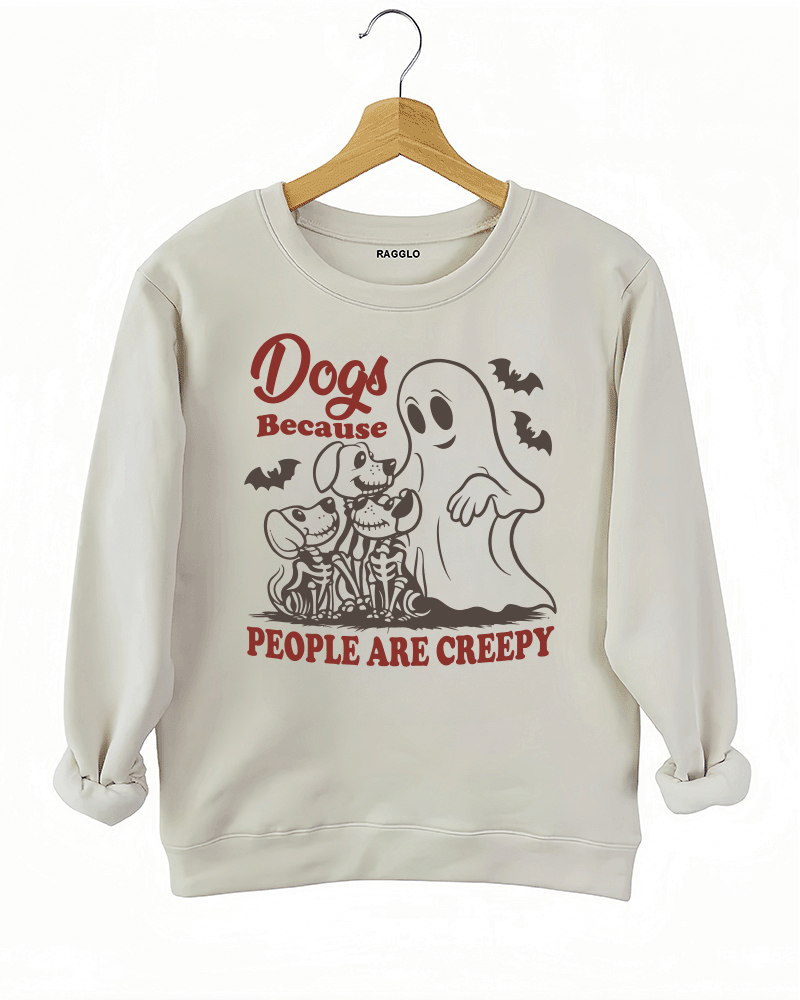 Ragglo beige women's sweatshirt featuring three skeleton dogs, a playful ghost, and bats with the humorous text 'Dogs Because People Are Creepy' in a spooky design.