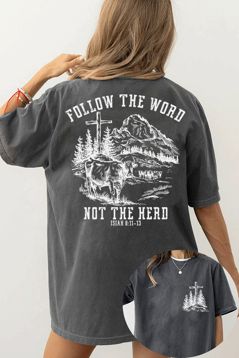 Ragglo dark gray women's T-Shirt featuring a minimalist cross and trees design on the front, and a mountain landscape with cattle, a cross, and trees on the back with the text 'Follow The Word Not The Herd' and 'Isaiah 8:11-13' in a faith-inspired graphic design.