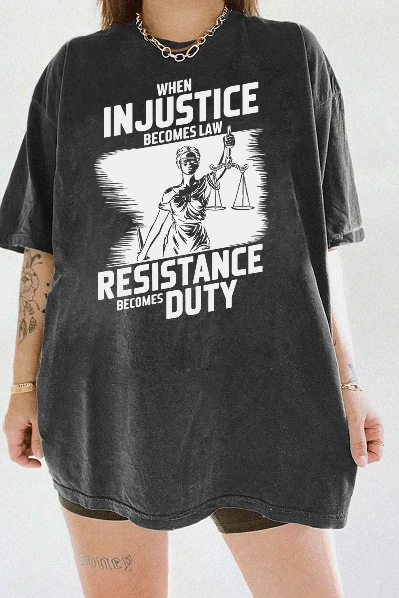 Ragglo dark gray women's tee with white 'When Injustice Becomes Law, Resistance Becomes Duty' slogan and Lady Justice design pattern