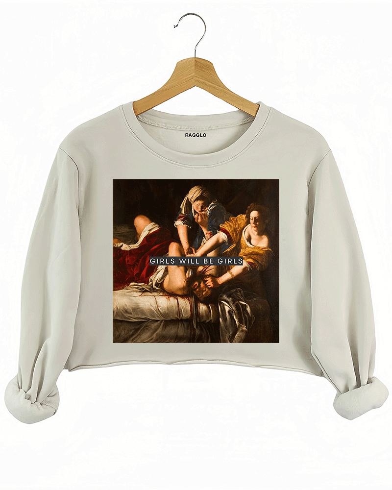 Ragglo beige women's crop sweatshirt with Judith Beheading Holofernes design and "Girls Will Be Girls" text.