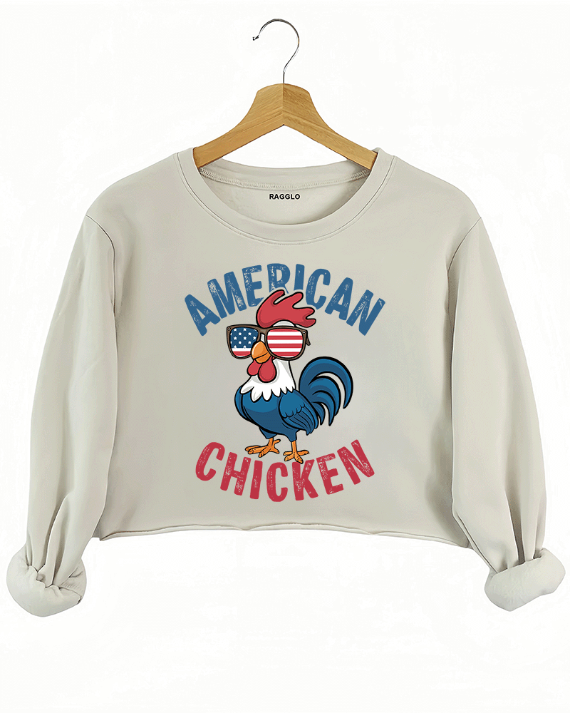 Ragglo beige crop sweatshirt featuring 'AMERICAN CHICKEN' text with a chicken wearing USA flag sunglasses, perfect for funny patriotic streetwear and showing USA pride.