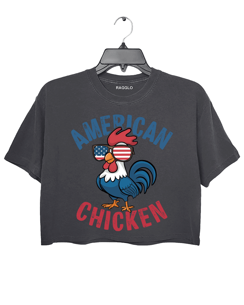 Ragglo dark gray crop top featuring 'AMERICAN CHICKEN' text with a chicken wearing USA flag sunglasses, perfect for funny patriotic streetwear and showing USA pride.