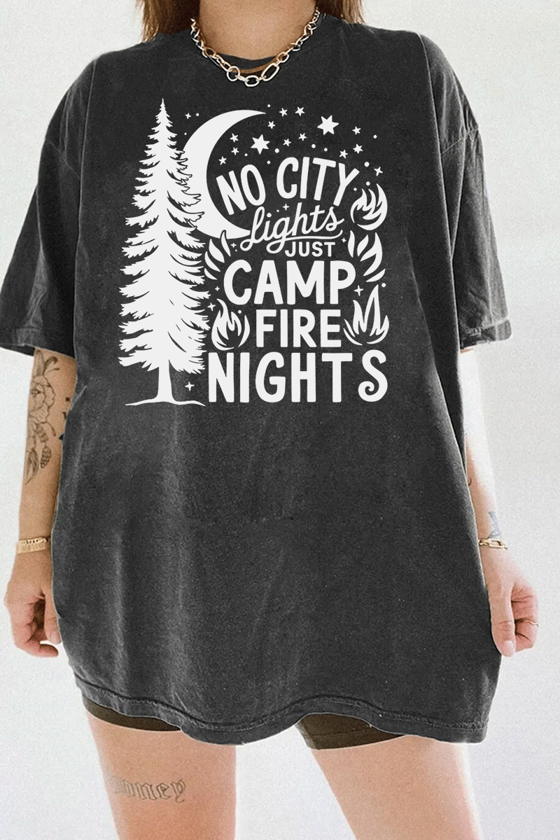 Ragglo dark gray tee featuring a pine tree, moon, stars, and campfire elements, with 'NO CITY LIGHTS JUST CAMP FIRE NIGHTS' text, perfect for outdoor camping streetwear for nature lovers.