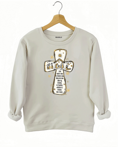 Ragglo beige sweatshirt featuring a cross with a nativity scene, stars, and snowflakes, with 'Unto you is born this day in the city of David, a Savior which is Christ the Lord' text, perfect for religious Christmas streetwear.