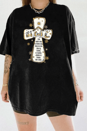 Ragglo black tee featuring a cross with a nativity scene, stars, and snowflakes, with 'Unto you is born this day in the city of David, a Savior which is Christ the Lord' text, perfect for religious Christmas streetwear.