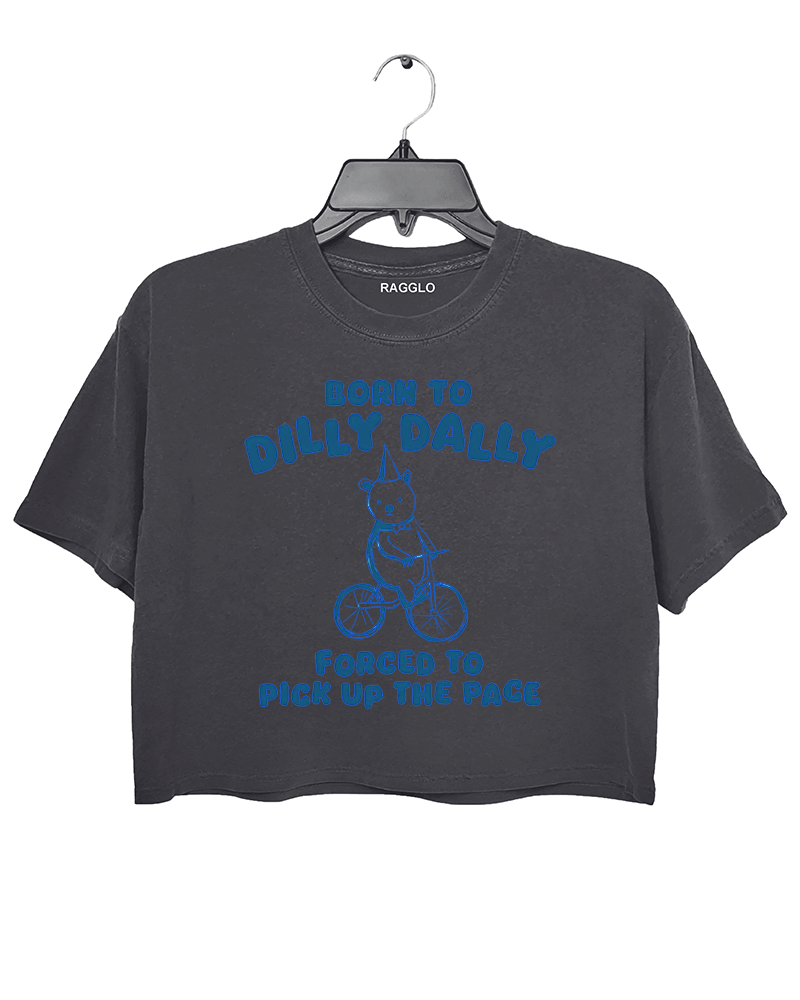 Ragglo dark gray crop top featuring a bear in a party hat riding a bicycle with 'BORN TO DILLY DALLY FORCED TO PICK UP THE PACE' text, perfect for funny casual streetwear.