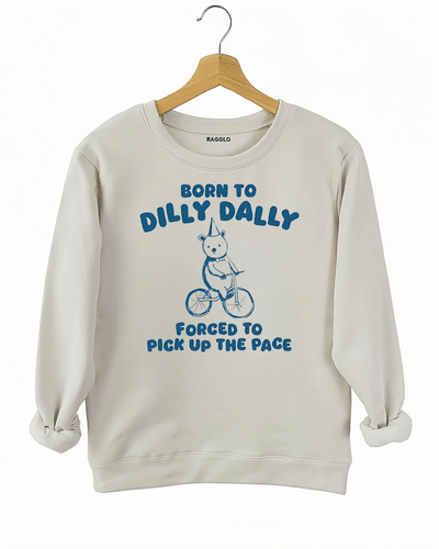 Ragglo beige sweatshirt featuring a bear in a party hat riding a bicycle with 'BORN TO DILLY DALLY FORCED TO PICK UP THE PACE' text, perfect for funny casual streetwear.