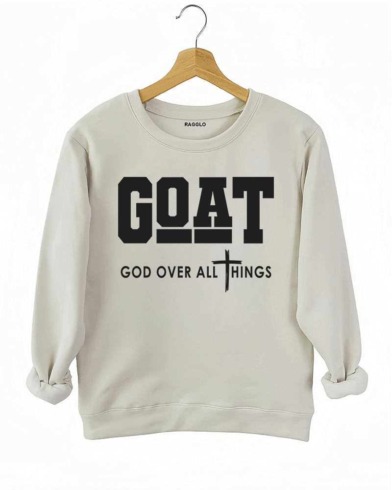 Ragglo beige sweatshirt with "GOAT God Over All Things" text and cross symbol in white, featuring a Christian faith-inspired design.