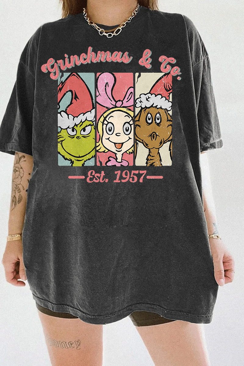 Ragglo dark gray T-shirt featuring The Grinch, Cindy Lou Who, and Max in Santa hats with 'GRINCHMAS & GO' text and 'EST. 1957', perfect for festive holiday streetwear and Grinch fans.