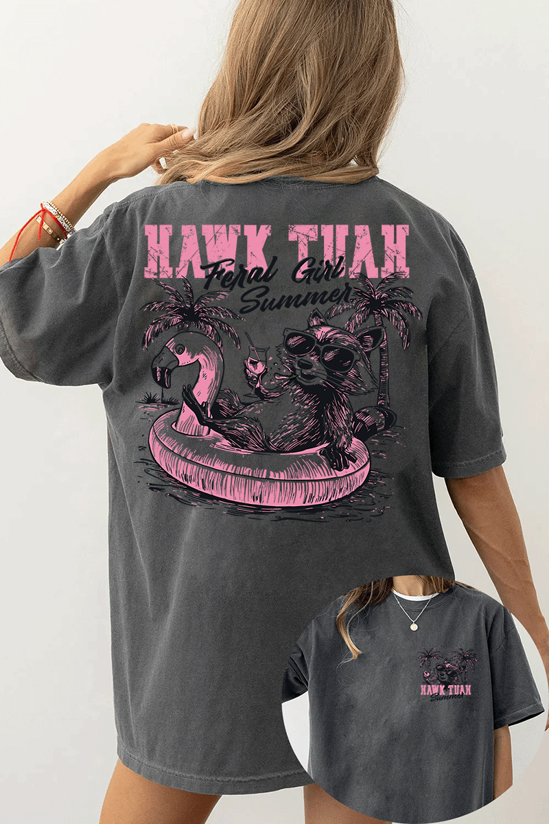 Ragglo dark gray T-shirt front and back view, featuring a raccoon in sunglasses on a flamingo float with 'HAWK TUAH FERAL GIRL SUMMER' text and palm trees, perfect for playful vacation streetwear.