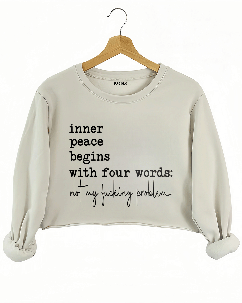 Ragglo beige crop sweatshirt featuring 'inner peace begins with four words: not my f**king problem' text, perfect for sassy streetwear and carefree attitude enthusiasts.