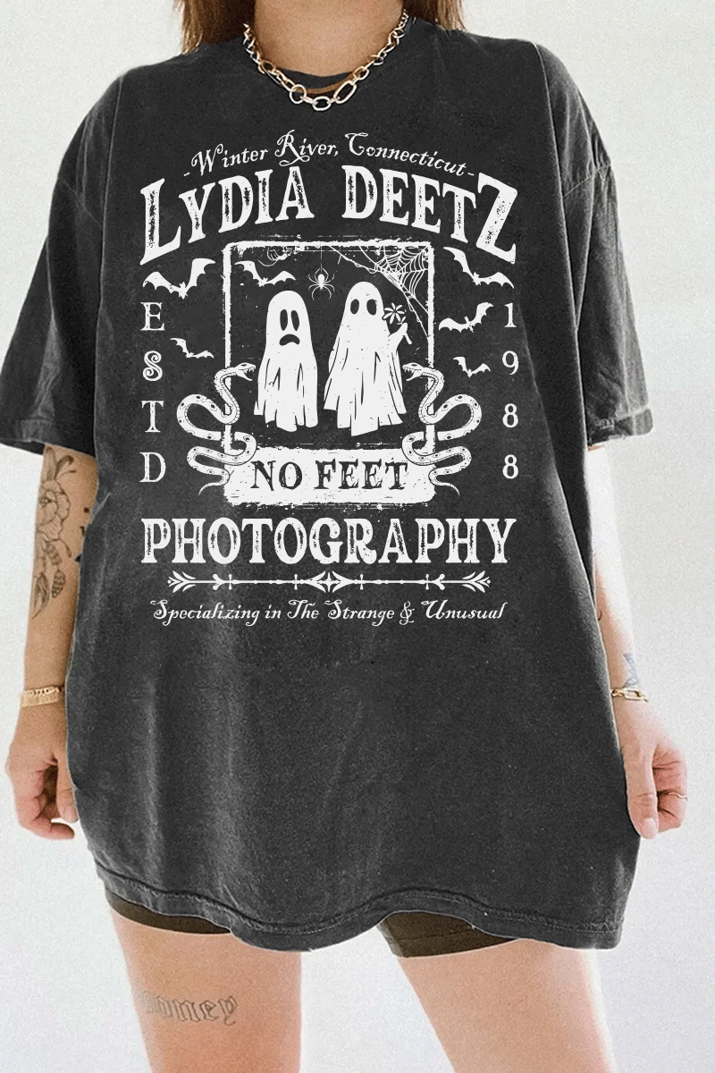 Ragglo dark gray T-shirt with "Lydia Deetz Photography No Feet" graphic featuring two ghosts, inspired by Beetlejuice with a gothic and supernatural theme.