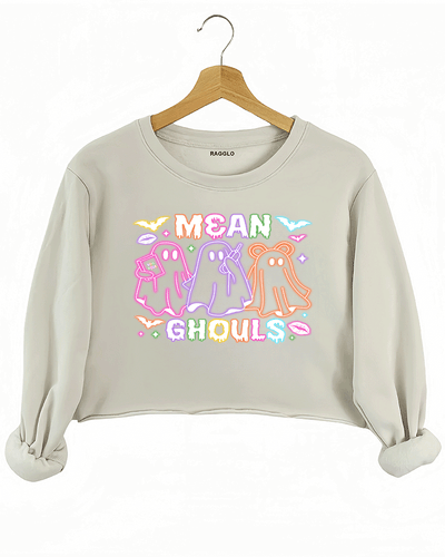 Ragglo beige crop sweatshirt with "Mean Ghouls" neon ghost graphic in pink, purple, and orange, featuring a playful Halloween and Mean Girls parody theme.