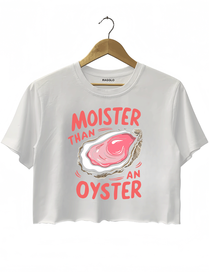 Ragglo white crop top featuring 'MOISTER THAN AN OYSTER' text with an oyster graphic, perfect for cheeky streetwear and playful, flirty vibes.