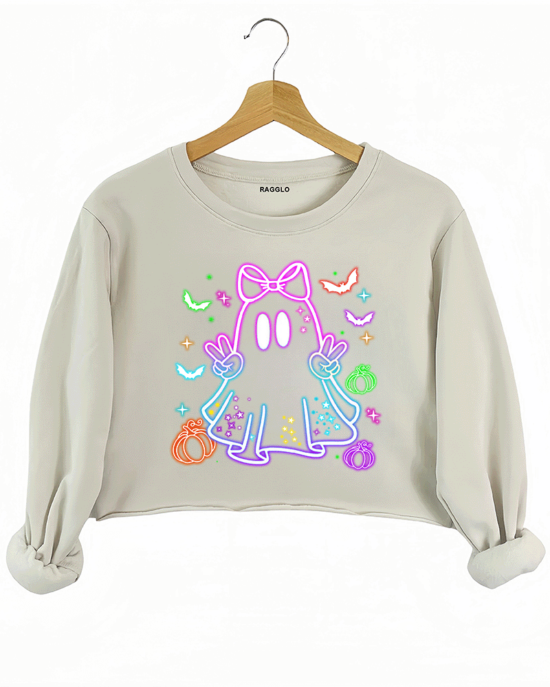 Ragglo beige crop sweatshirt featuring a neon-style ghost with a pink bow, surrounded by bats, pumpkins, and stars, perfect for cute Halloween streetwear.