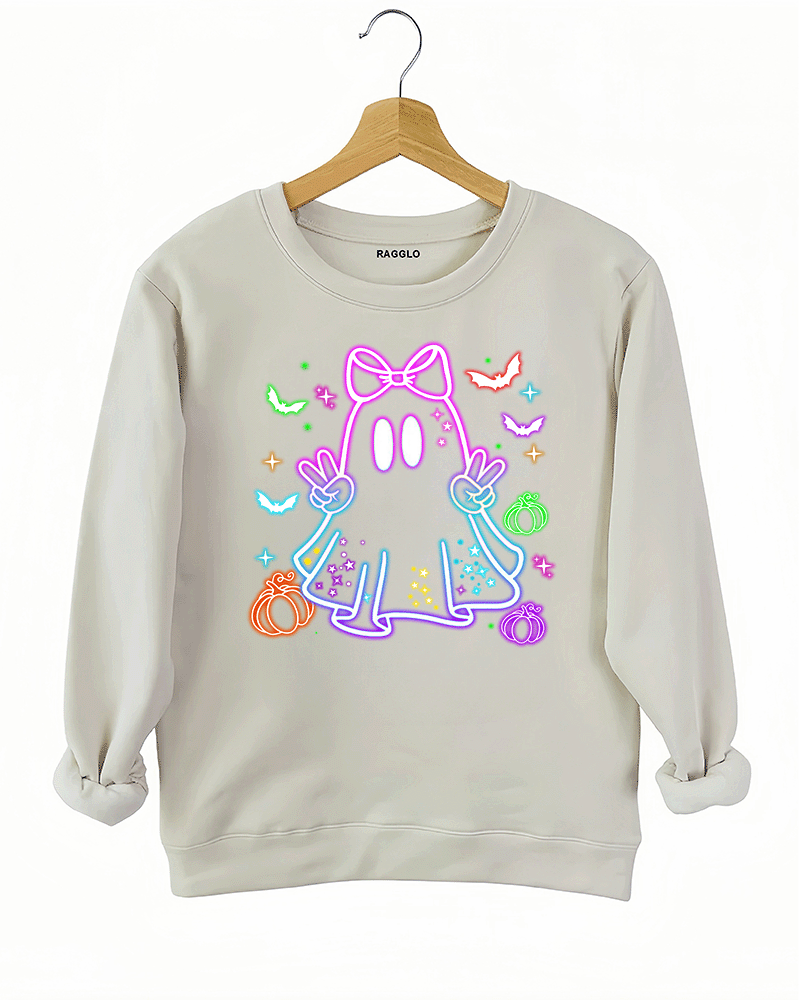 Ragglo beige sweatshirt featuring a neon-style ghost with a pink bow, surrounded by bats, pumpkins, and stars, perfect for cute Halloween streetwear.