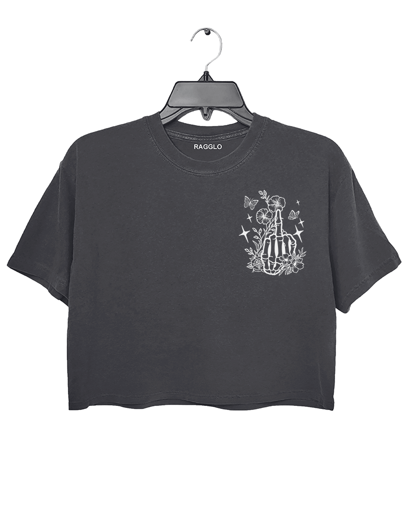 Ragglo dark gray crop top front view featuring a skeleton hand with a middle finger gesture surrounded by flowers, butterflies, and stars, perfect for bold streetwear style.