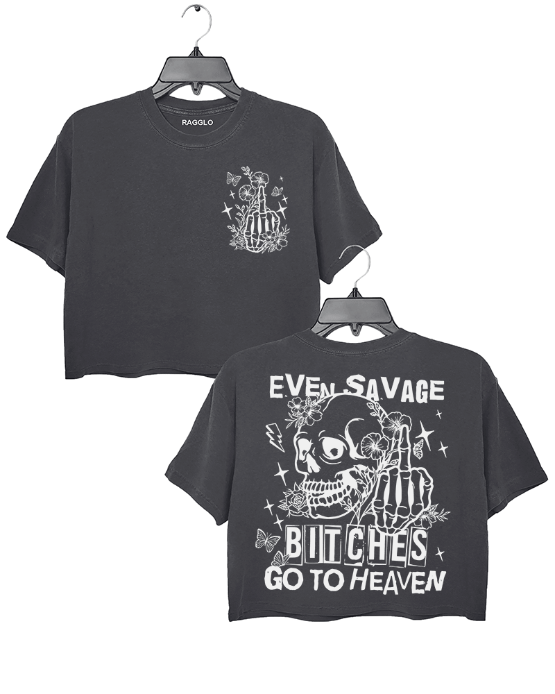 Ragglo dark gray crop top featuring front and back views: the front shows a skeleton hand with a middle finger gesture surrounded by flowers, butterflies, and stars; the back displays a skull with a skeleton hand giving a middle finger, surrounded by flowers, butterflies, and stars, with 'EVEN SAVAGE BITCHES GO TO HEAVEN' text, perfect for bold and humorous streetwear.