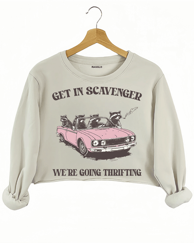 Ragglo beige crop sweatshirt featuring raccoons in a pink convertible car, with 'GET IN SCAVENGER WE’RE GOING THRIFTING' text, perfect for funny retro streetwear for thrifting enthusiasts.