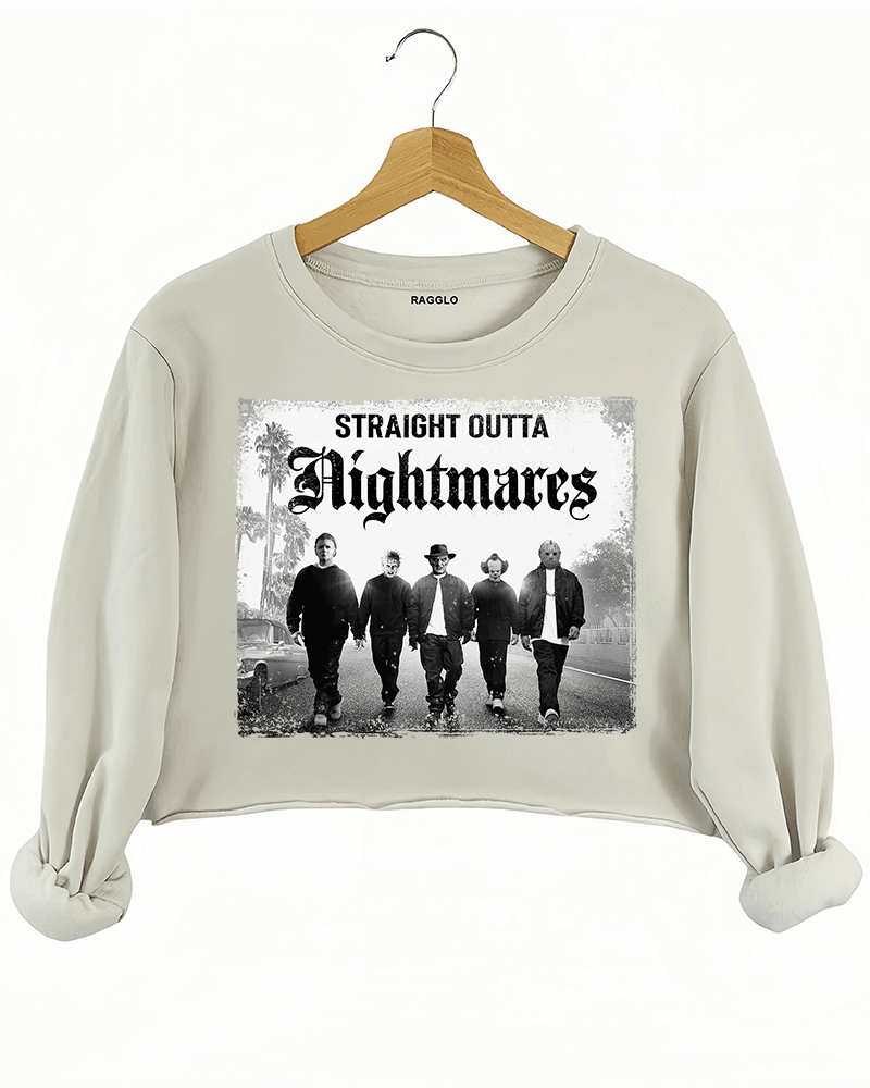 Ragglo beige crop sweatshirt with "Straight Outta Nightmares" graphic featuring five figures on a road, blending horror movie and hip-hop culture themes.