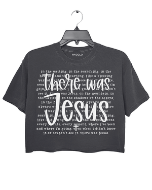 Ragglo dark gray crop top with "There Was Jesus" text in white, featuring a Christian faith-inspired design with spiritual lyrics.