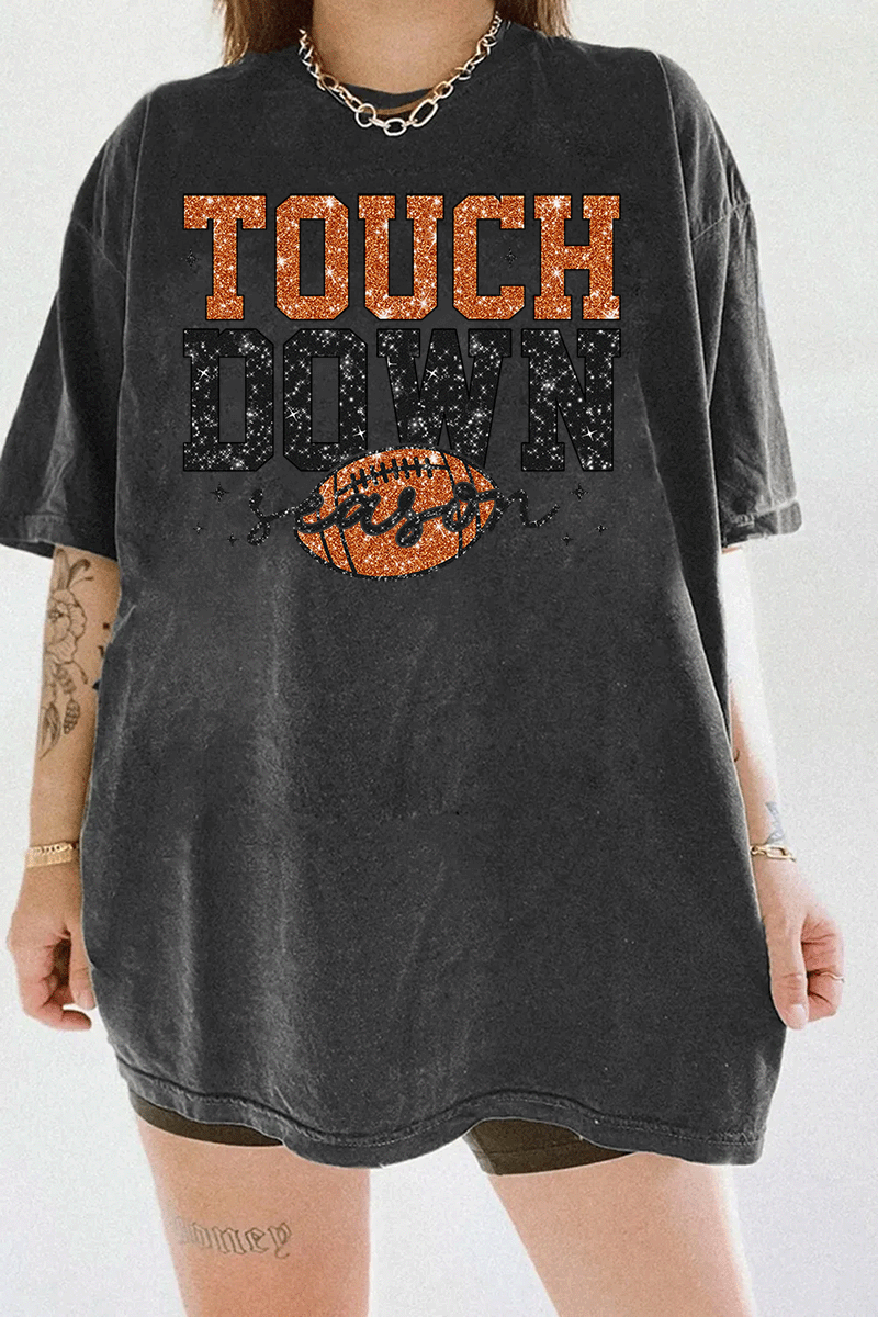 Ragglo dark gray T-shirt featuring 'TOUCH DOWN' text with a football graphic and 'season' script, accented by stars, perfect for football fans and game day streetwear.