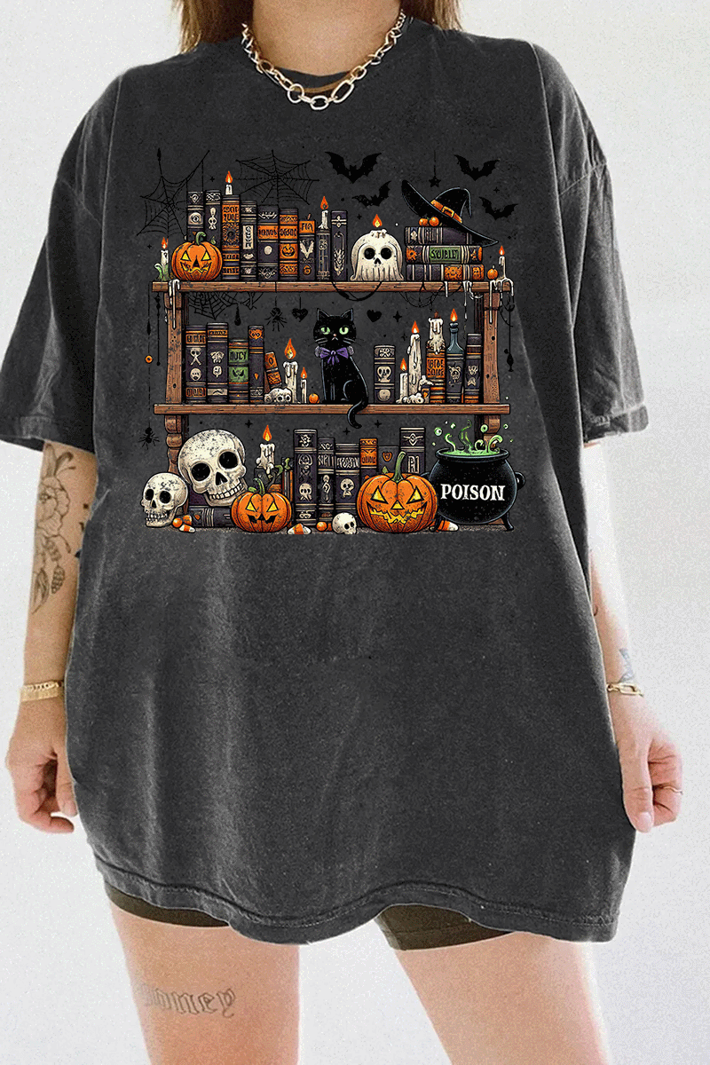 Ragglo dark gray T-shirt featuring a spooky bookshelf with magic books, pumpkins, skulls, a black cat, and a 'POISON' potion bottle, accented by bats and spiderwebs, perfect for Halloween streetwear and witchy vibes.