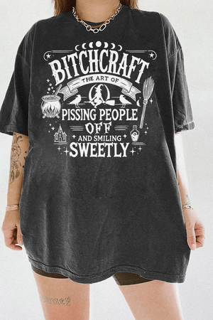 Dark gray T-shirt with 'Bitch Craft' design available on Ragglo, featuring edgy witchcraft elements for a rebellious look.