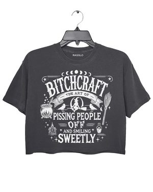 Dark gray crop top with 'Bitch Craft' design available on Ragglo, featuring a witchcraft-themed graphic for bold and empowering style.