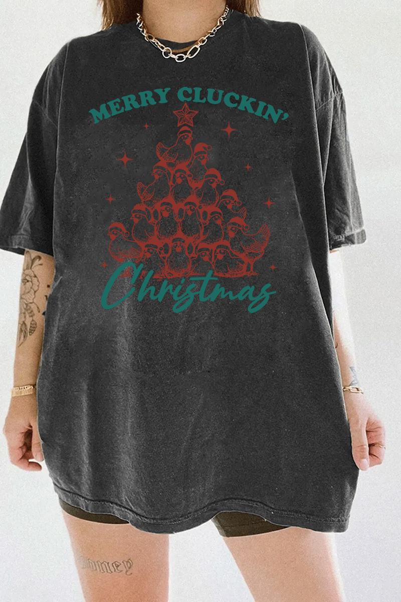 Merry Cluckin' Christmas graphic featuring chickens in a tree shape with Santa hats and festive text on a dark gray T-shirt, available on Ragglo.