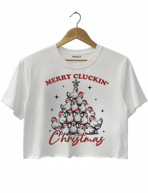 Funny Christmas design with chickens forming a Christmas tree and wearing Santa hats, with the text 'Merry Cluckin' Christmas' on a white crop top, available on Ragglo.