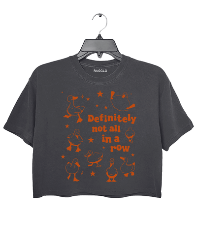 Dark gray crop top featuring the 'Definitely Not All in a Row' graphic, with playful ducks scattered in various poses and bold text, adding a touch of humor and fun.