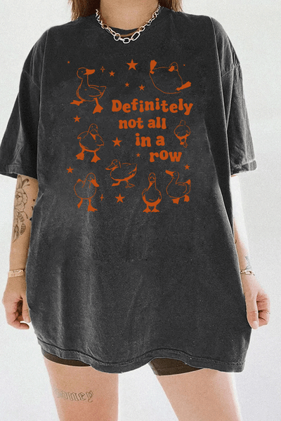 Dark gray T-shirt showcasing the 'Definitely Not All in a Row' graphic design, with a group of ducks in various poses and playful text, perfect for a fun and casual look.