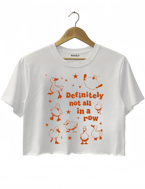 White crop top with the 'Definitely Not All in a Row' design, showing cute, quirky ducks in different positions, paired with bold text to convey a humorous, laid-back vibe.