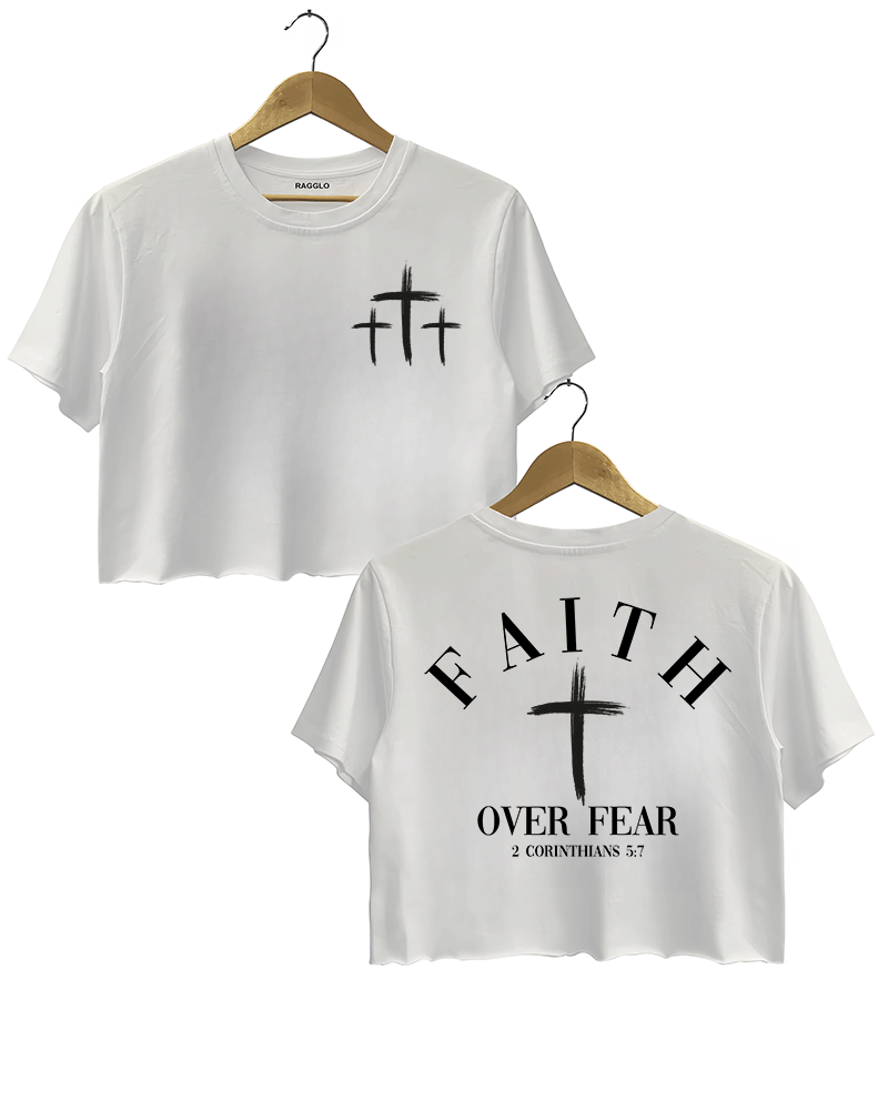 White Ragglo crop top with three small white cross designs on the front and "Faith Over Fear" with "2 Corinthians 5:7" text plus a prominent white cross design on the back.