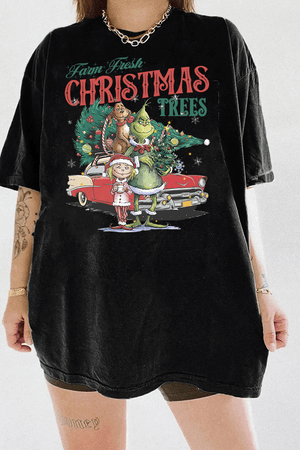 Black T-shirt featuring the Grinch Christmas scene with Grinch, Cindy Lou, and Max, surrounded by festive decorations.