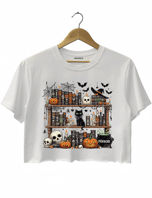 Ragglo white crop top featuring a Halloween-themed bookshelf with pumpkins, skulls, a black cat, witch hat, potion cauldron, and spooky candles, perfect for festive style and Halloween lovers.