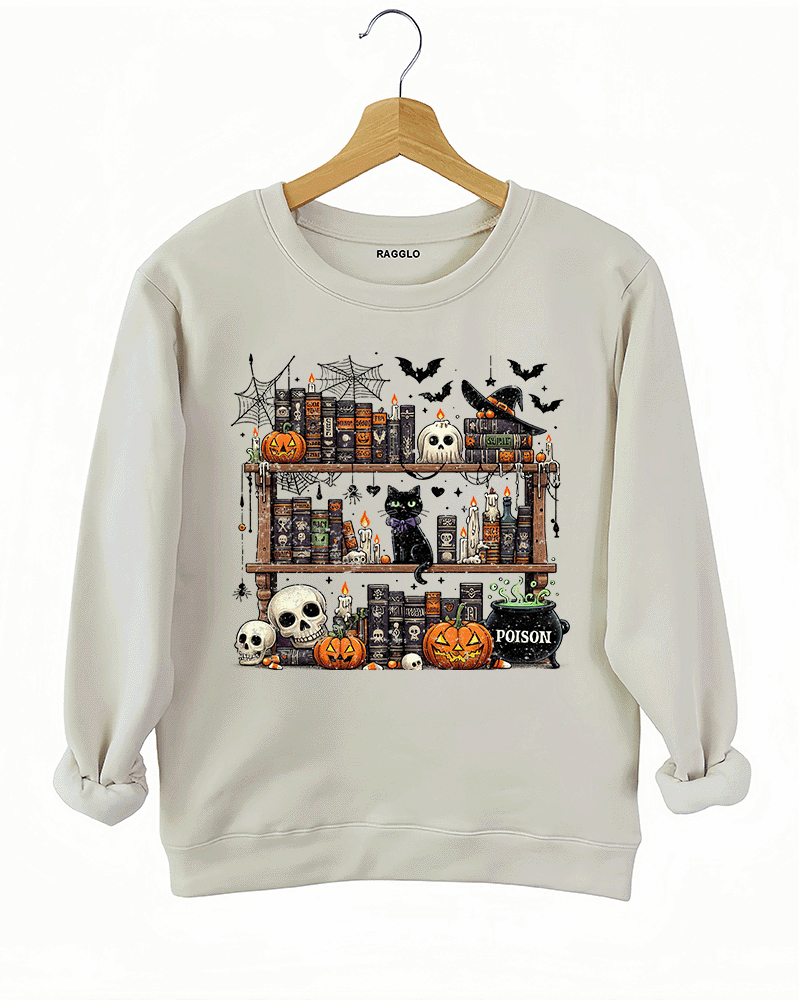 Ragglo beige sweatshirt featuring a Halloween-themed bookshelf with pumpkins, skulls, a black cat, witch hat, potion cauldron, and spooky candles, ideal for spooky season comfort and Halloween style.