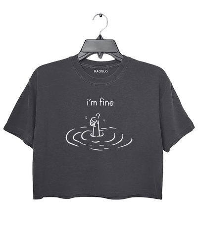 Dark gray crop top with 'I'm Fine' graphic showing a hand giving a thumbs-up emerging from water, symbolizing resilience and maintaining a positive attitude despite challenges.