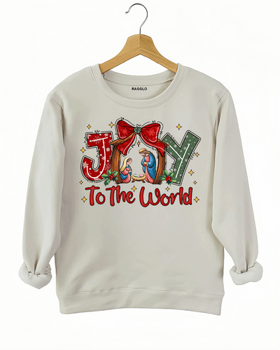 Religious Christmas design with nativity scene and 'Joy to the World' text on a beige sweatshirt, available on Ragglo.