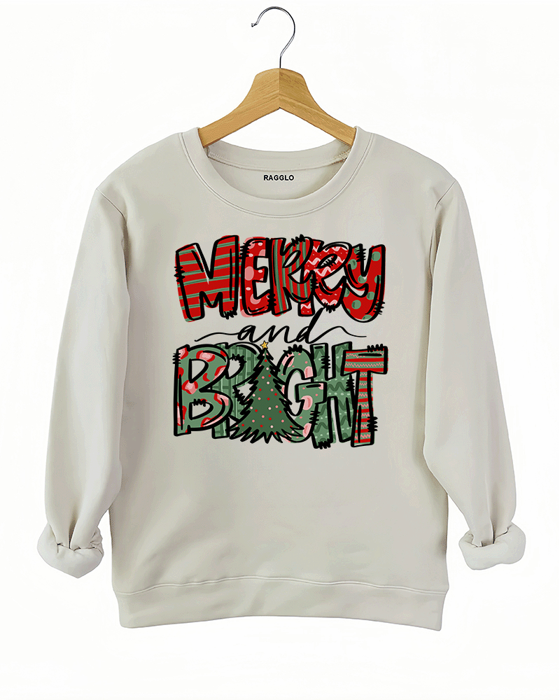 Beige sweatshirt with the Merry & Bright Christmas-themed graphic, showcasing colorful red and green holiday patterns and a Christmas tree, available at Ragglo.