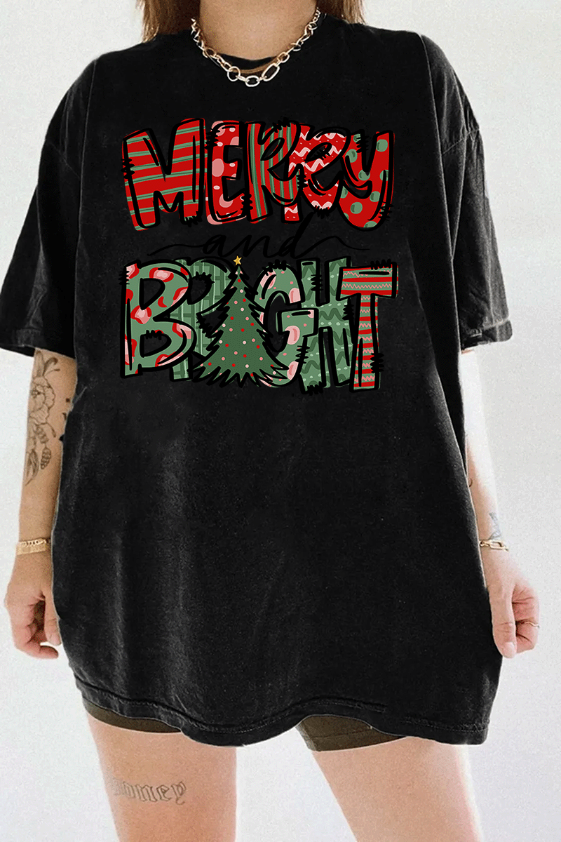 Black T-shirt showcasing the Merry & Bright festive design with red and green patterns and a Christmas tree, available at Ragglo.