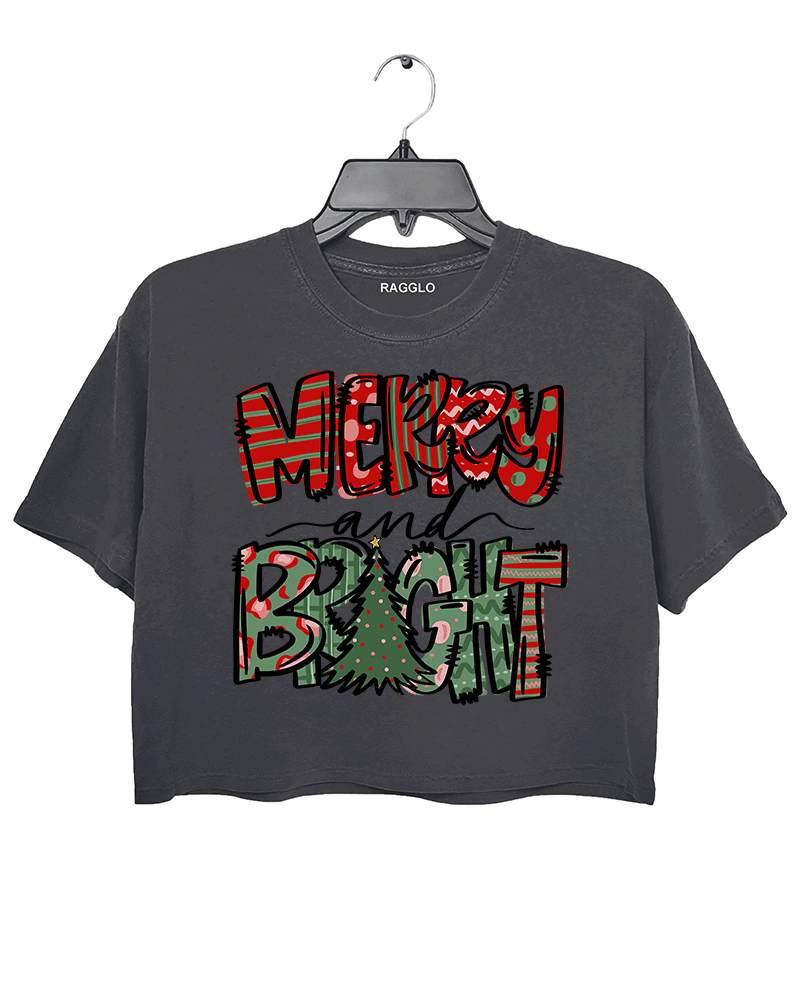 Dark gray crop top featuring the Merry & Bright Christmas-themed graphic with festive red and green patterns and a Christmas tree, available at Ragglo.