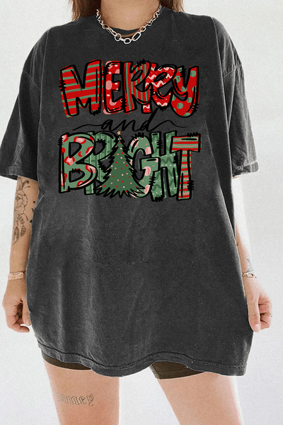 Dark gray T-shirt showcasing the Merry & Bright festive design with red and green patterns and a Christmas tree, available at Ragglo.