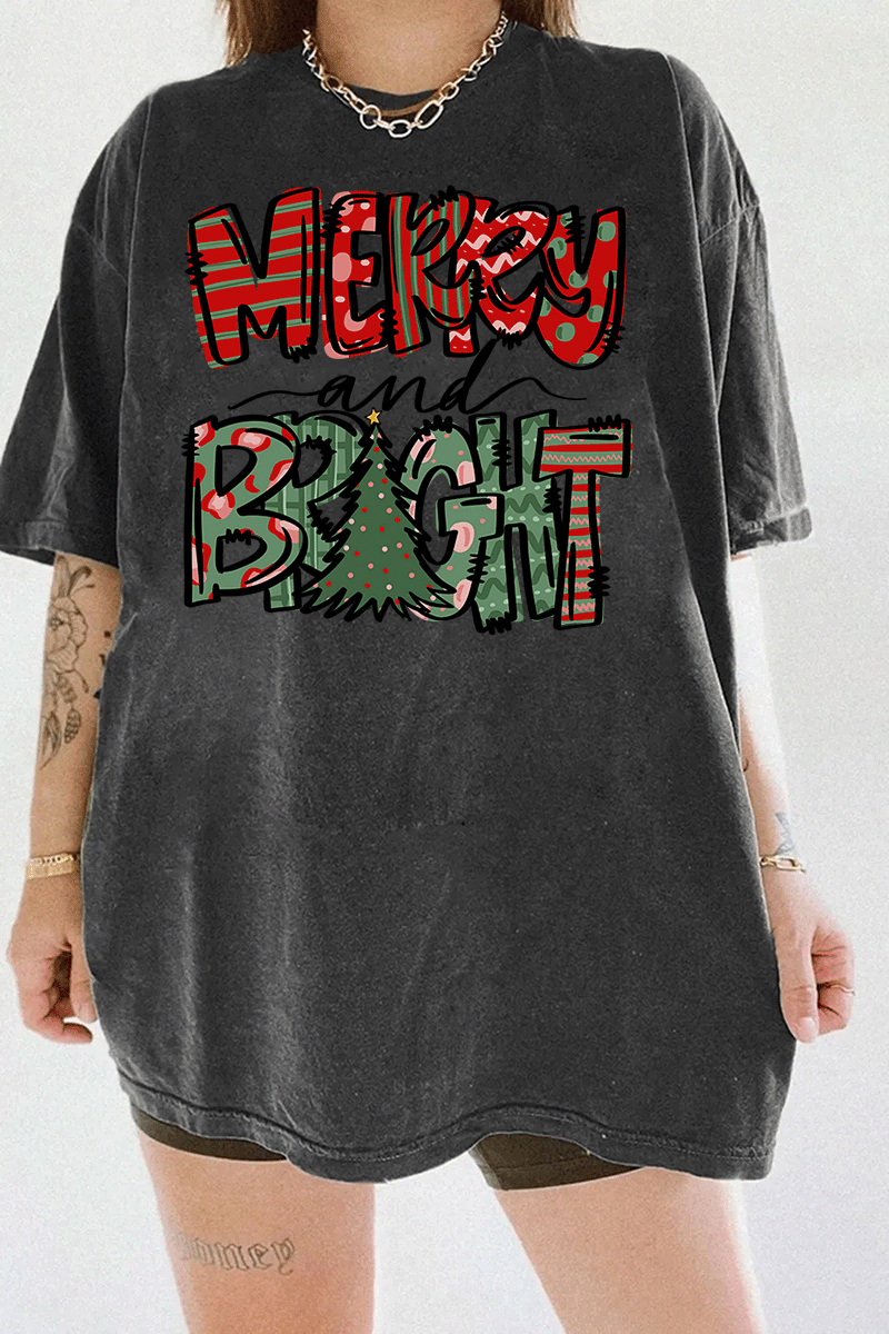 Dark gray T-shirt showcasing the Merry & Bright festive design with red and green patterns and a Christmas tree, available at Ragglo.