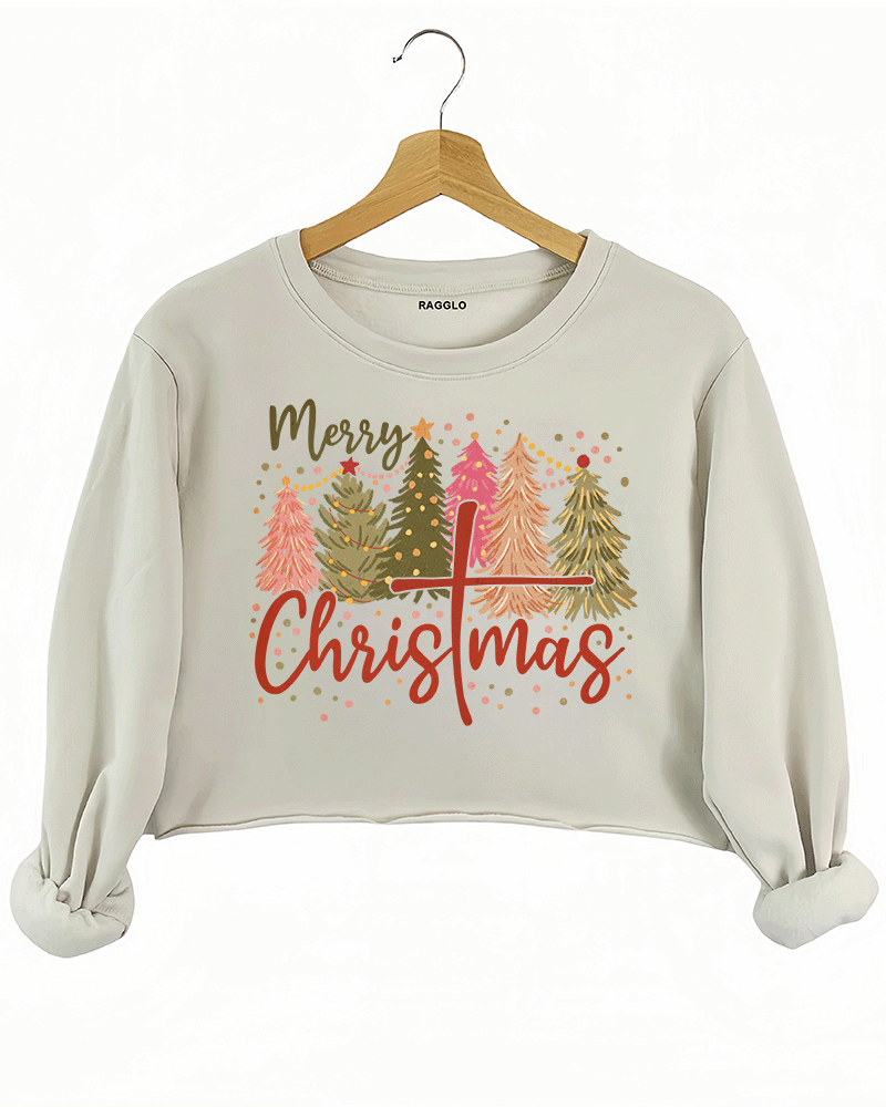 Ragglo beige crop sweatshirt featuring a playful 'Merry Christmas' design with stylized Christmas trees and a cross symbol embedded in the word 'Christmas.'