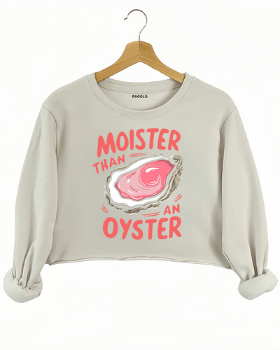 Beige crop sweatshirt showcasing the 'Moister than an Oyster' graphic, with a detailed oyster illustration and bold text, perfect for a fun, lighthearted look.