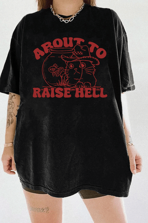 Ragglo black women's t - shirt with 'About to Raise Hell' text and cat in cowboy hat graphic.


