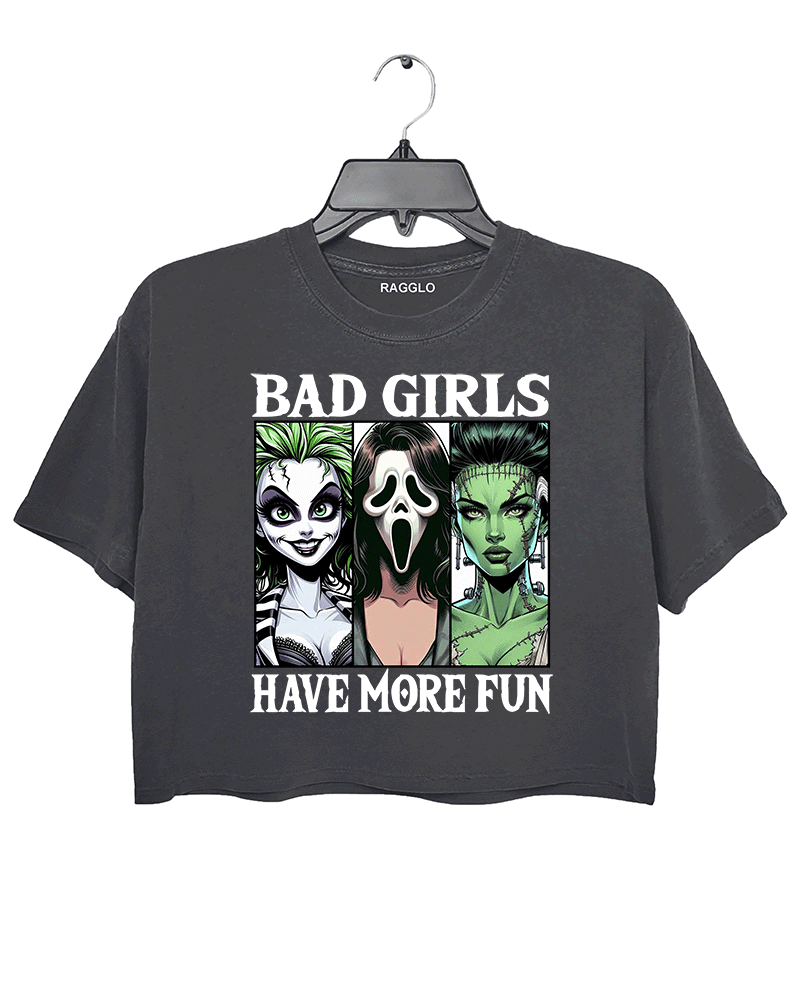 Ragglo dark gray horror-themed cropped t-shirt with "Bad Girls Have More Fun" text and illustrations of three iconic horror characters, ideal for Halloween and horror movie fans.

